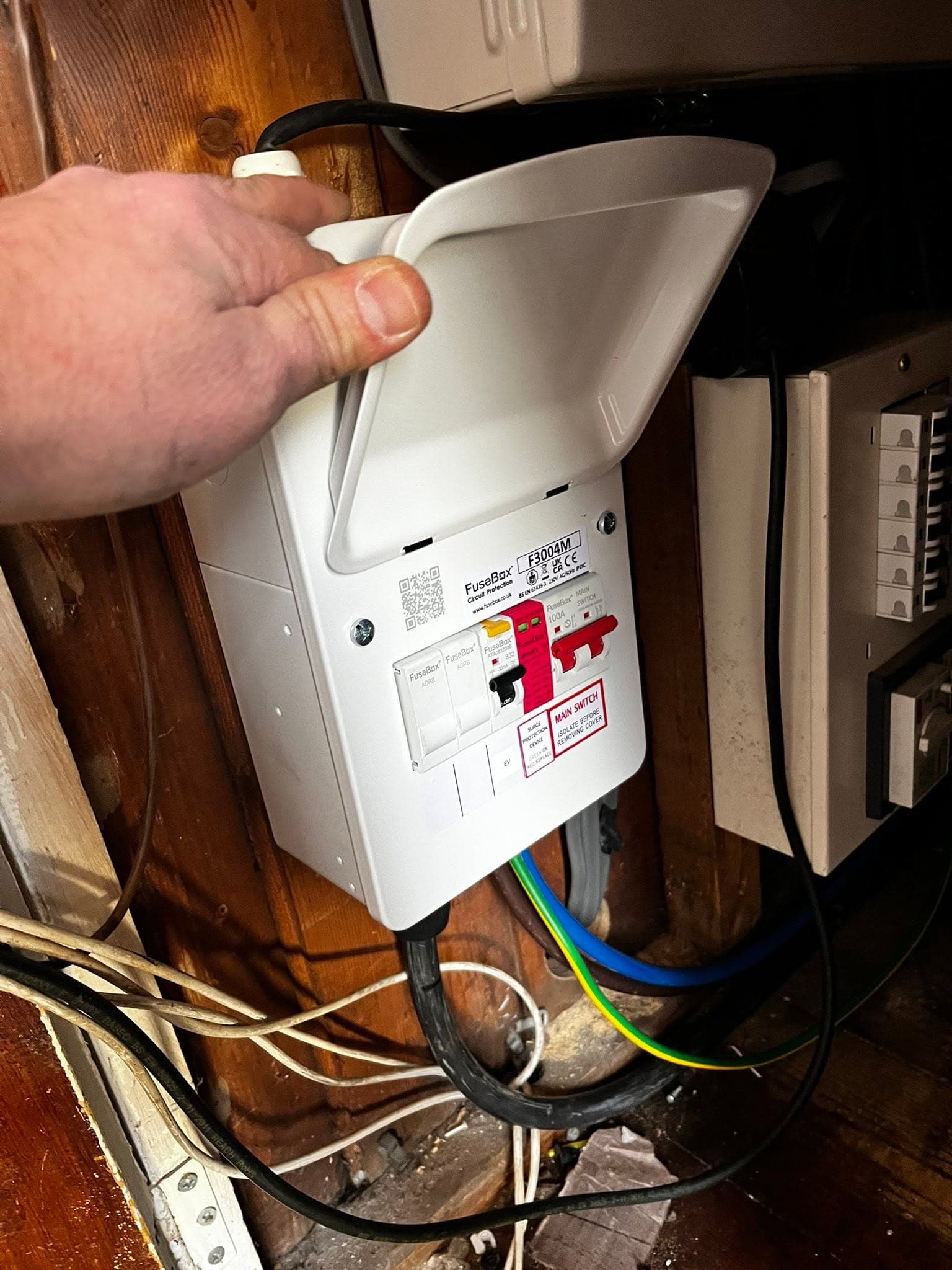 EV-ready FuseBox consumer unit being fitted, with surge protection and a dedicated EV way