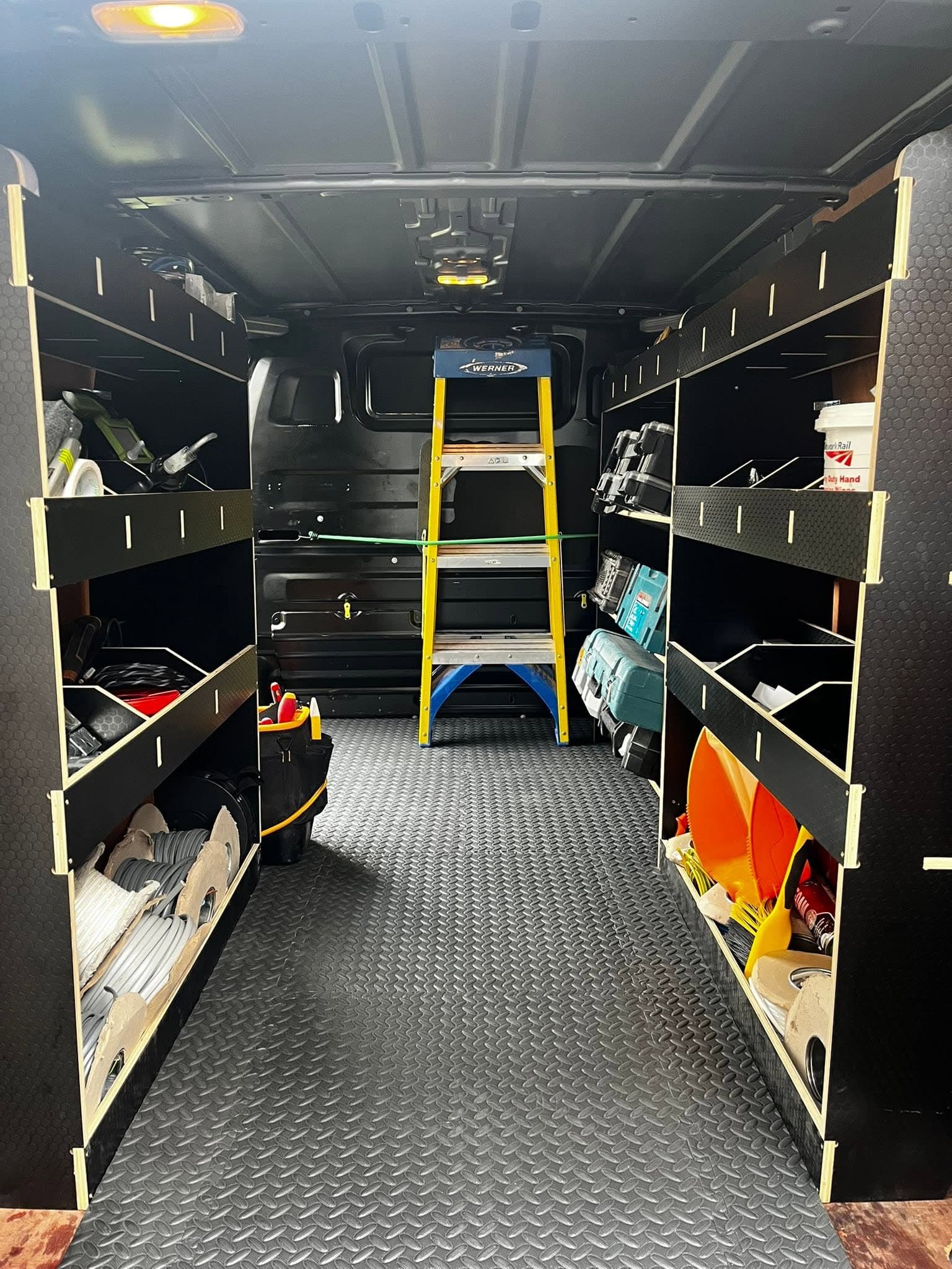 The MW Electrical work van, racked out and organised with tools, cable and test gear